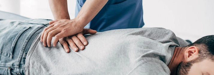 Chiropractic Orlando FL Chiropractic Adjustment Chiropractor adjusting a patients back.