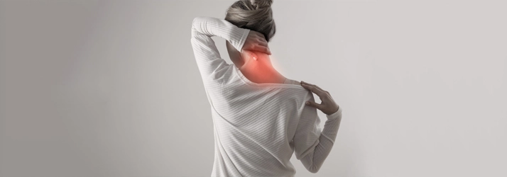 Chiropractic Orlando FL Neck Pain Person holding their neck.