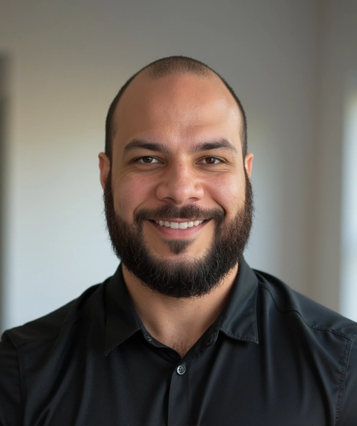 Dr. Christian Rosa Gonzalez smiling in a black shirt.